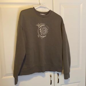 Cute sweater with artistic moon and sun design